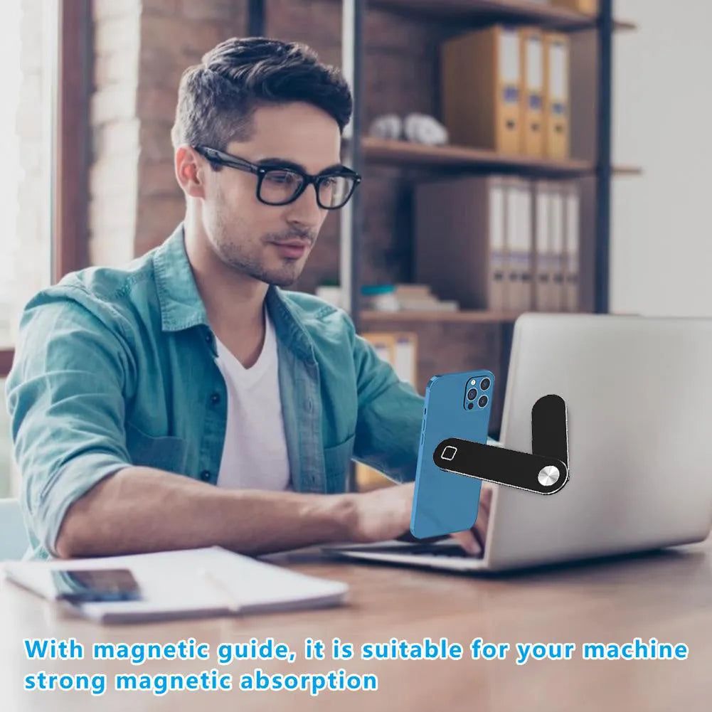 Black aluminium laptop phone holder with magnetic mount attached to laptop edge