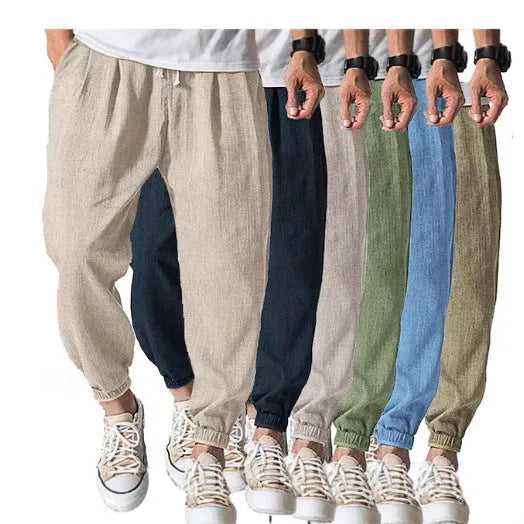 Men's loose-fitting cotton trousers with elasticated ankle bands in light green colour showing casual summer style