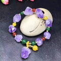 Natural shaped purple amethyst bead bracelet for women with a fu character charm.
