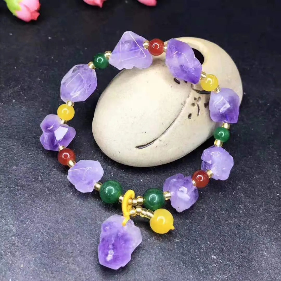 Natural shaped purple amethyst bead bracelet for women with a fu character charm.