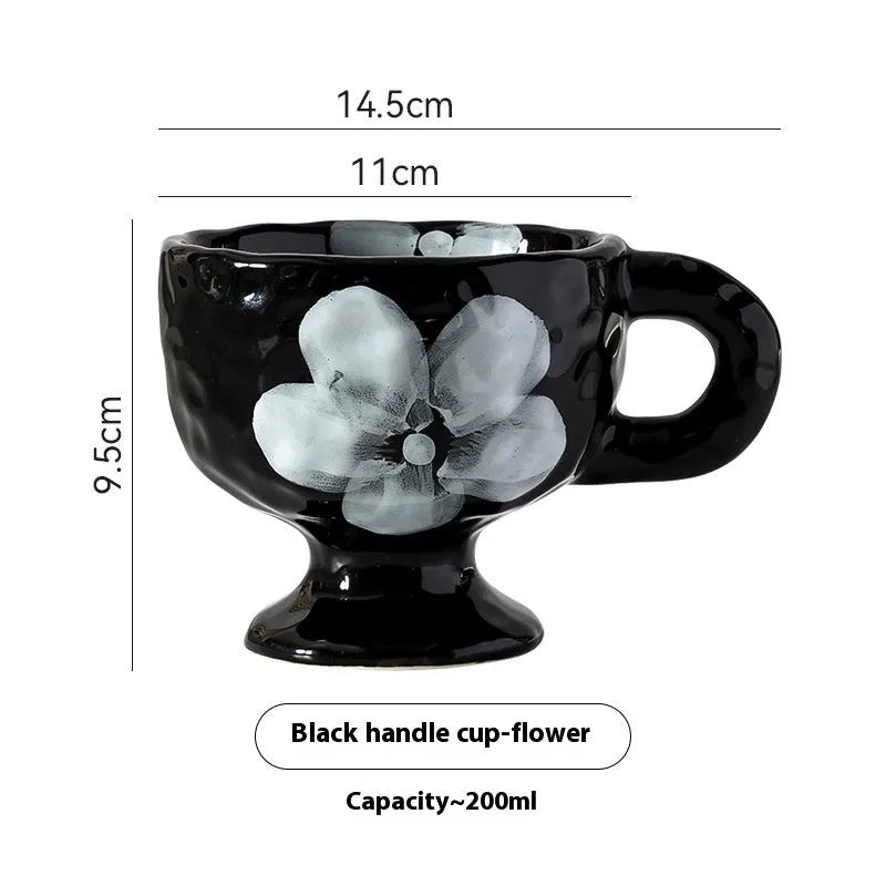 Hand-pinched irregular ceramic mug in a solid colour, shown from the side to display its unique shape.