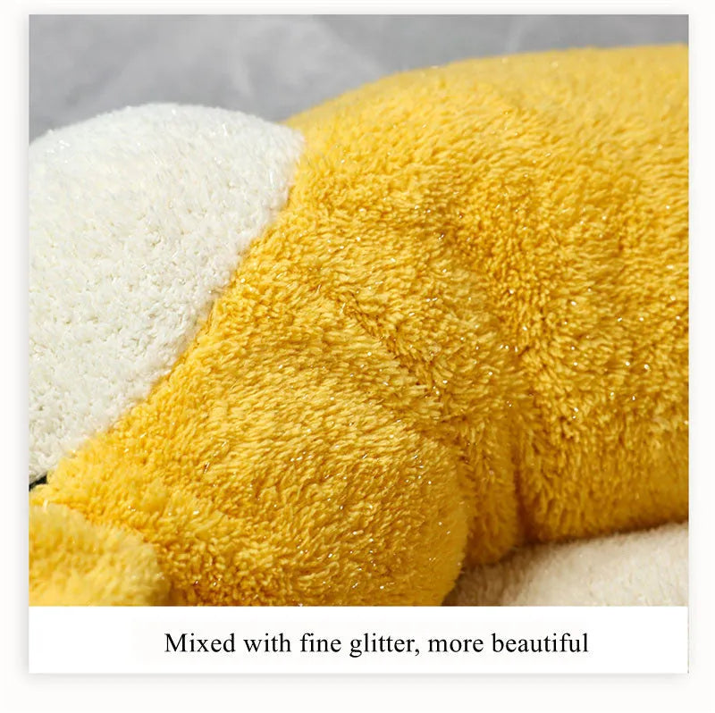 Brown and white corgi-shaped plush pet bed for dogs or cats on a wooden floor.