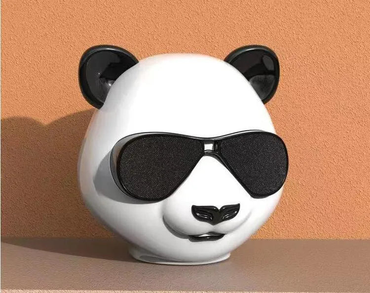 Classic style portable mini Bluetooth speaker shown on a table.