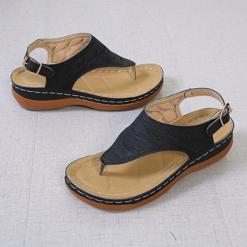 Women's casual wedge-heel sandals with adjustable buckle strap in a solid colour.