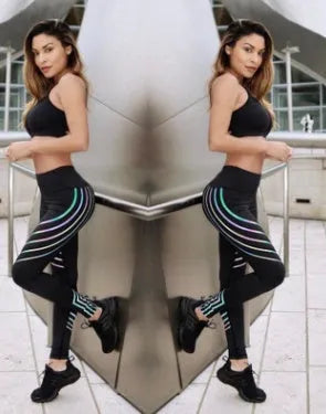 Women's black printed Milk Silk workout leggings with a slim fit, shown from the side.