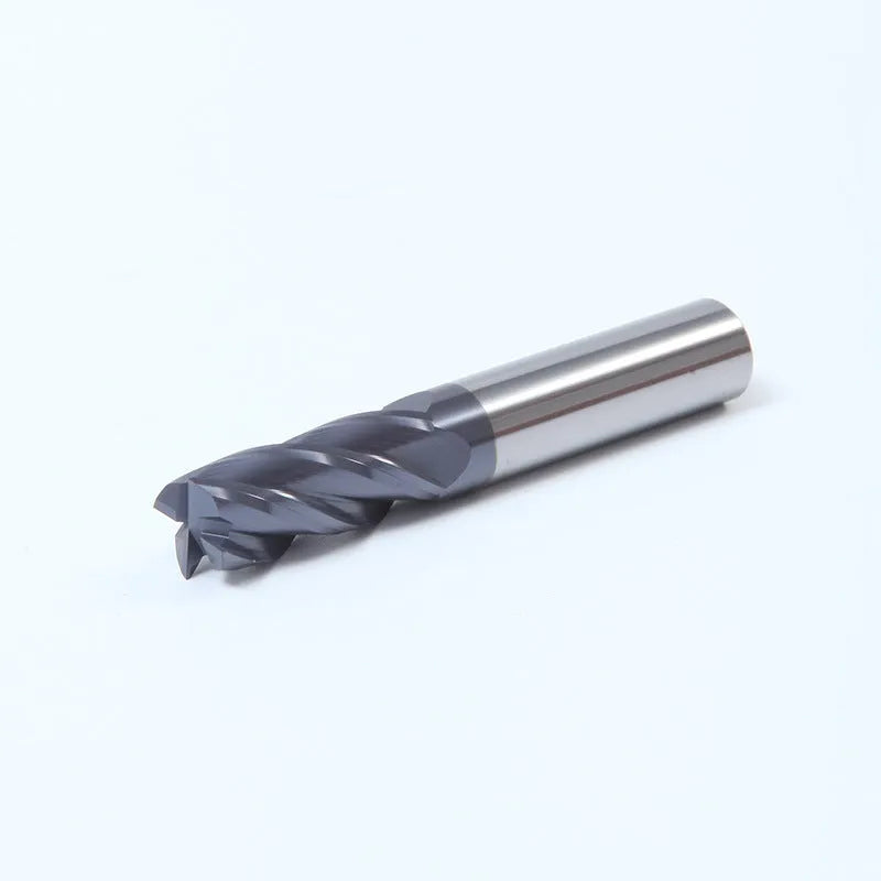 Carbide milling cutter with spiral flutes and straight shank on a grey background.