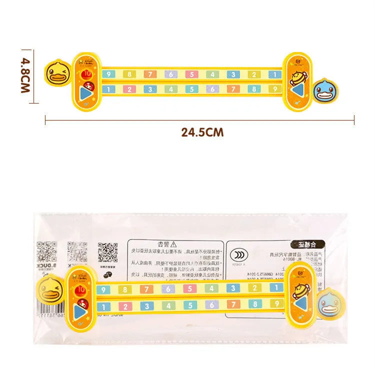 A yellow plastic children's cartoon digital decomposition ruler showing measurements up to 24.5 cm.