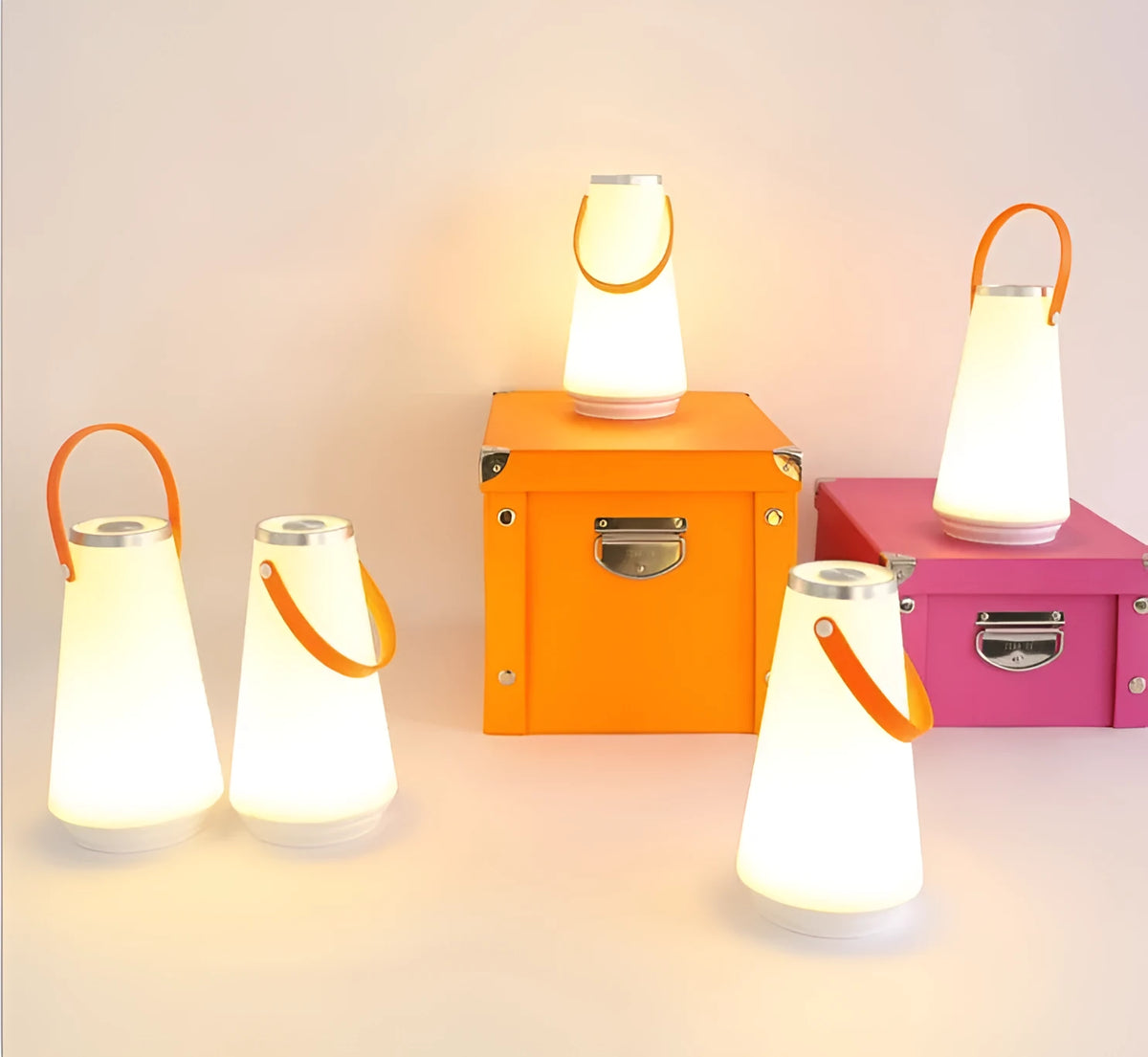 White rechargeable LED bedside lantern with warm light, shown next to a USB charging cable.