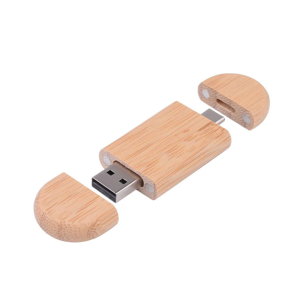 Maple wooden flash drive with USB and TYPE-C connectors on a wooden surface.