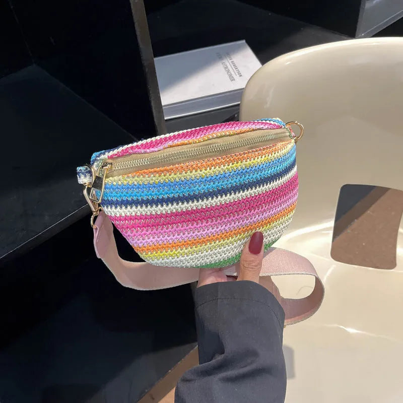 Bohemian style straw beach bag for women in shell shape with single strap and zipper closure available in pink or blue