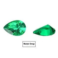 A loose cultivated emerald gemstone in Columbia green treasure colour on a white background.