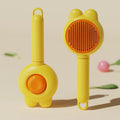 Green self-cleaning pet grooming brush with release button and stainless steel comb teeth.