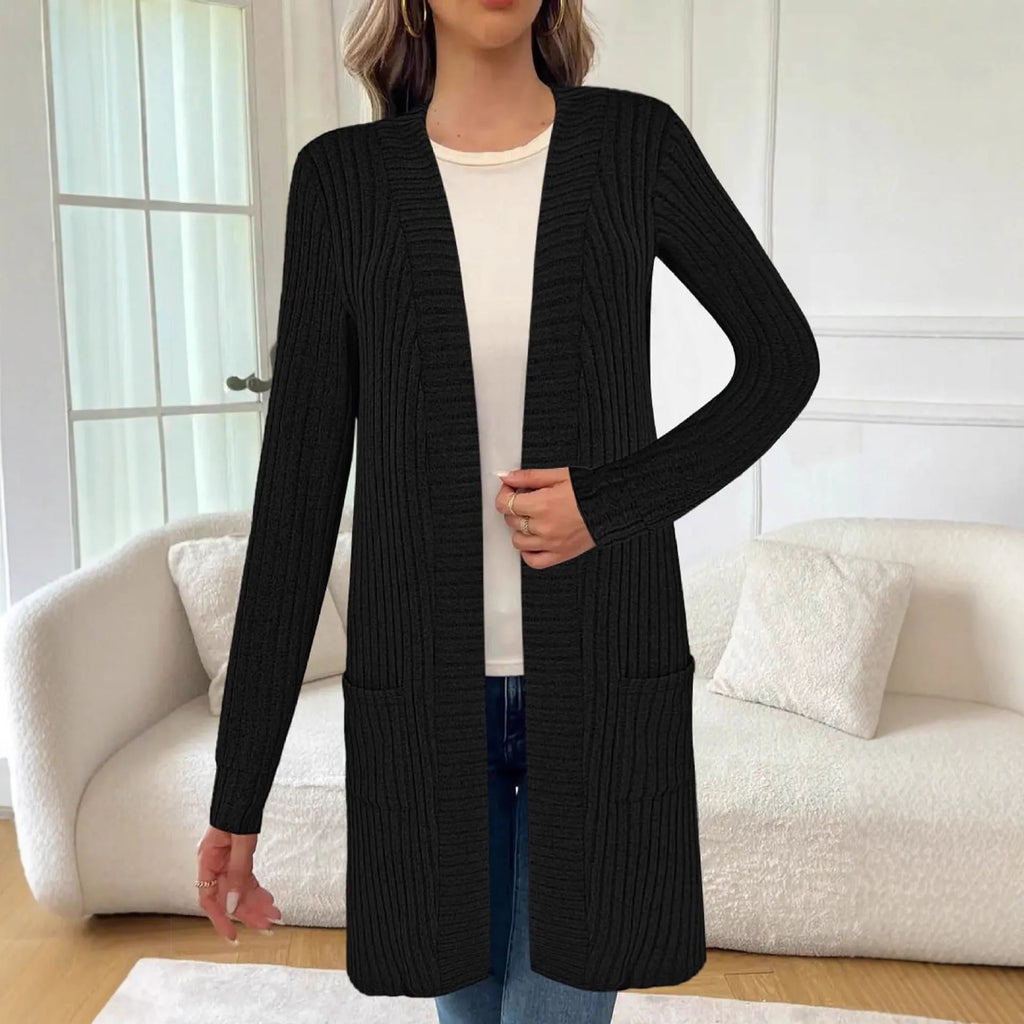 A woman's long sleeve loose-fit knitted cardigan jacket with pockets in wine red.