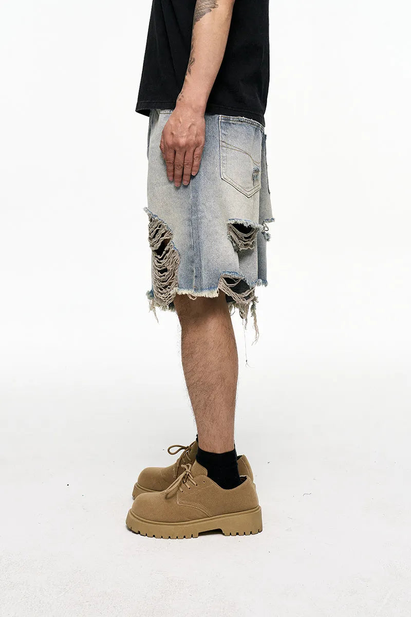 Men's light blue baggy denim shorts with a retro washed finish on a mid-waist