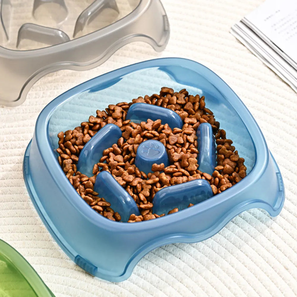 Blue plastic dog slow feeder bowl with anti-choking design on a white background