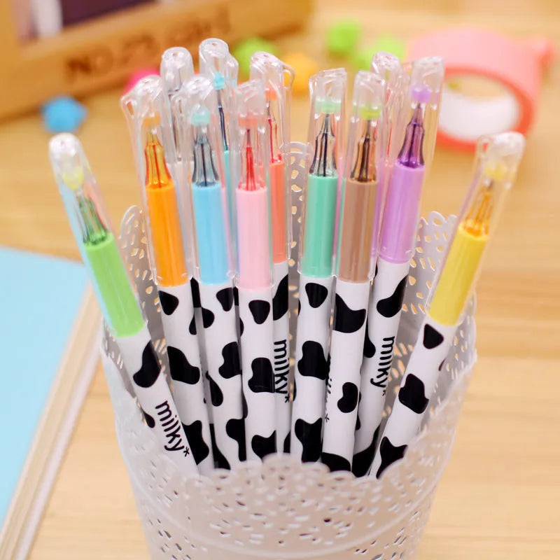 Cow-pattern gel pen set showing 12 different coloured pens with 0.38mm tips