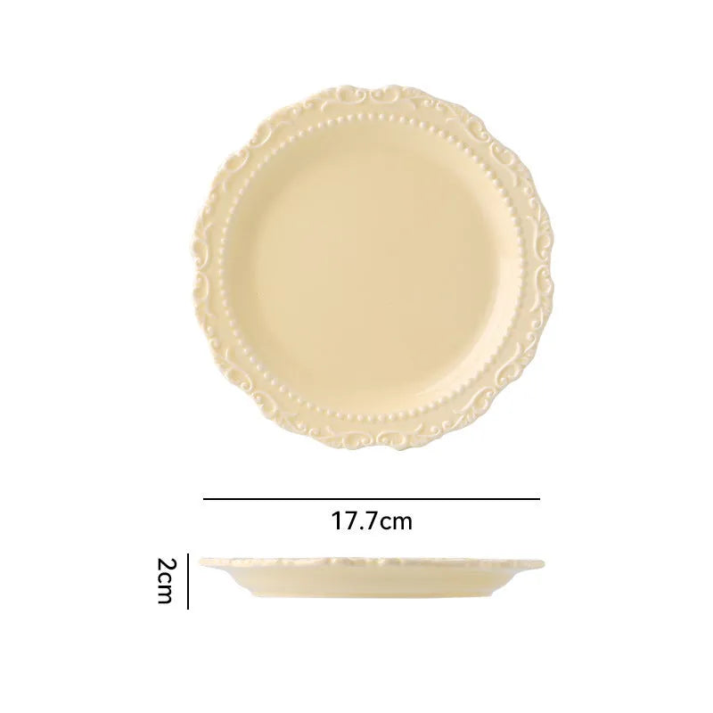 Vintage lace ceramic plate with irregular shape and coloured glaze in white or yellow