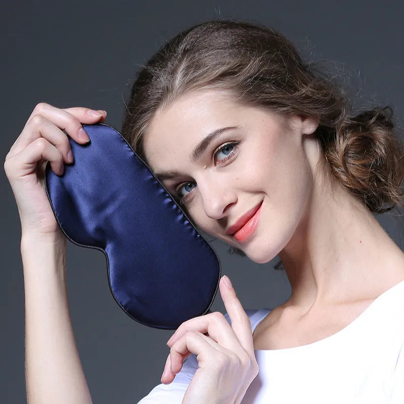 Double-sided mulberry silk sleep mask in multiple colours showing embroidered print and adjustable strap.