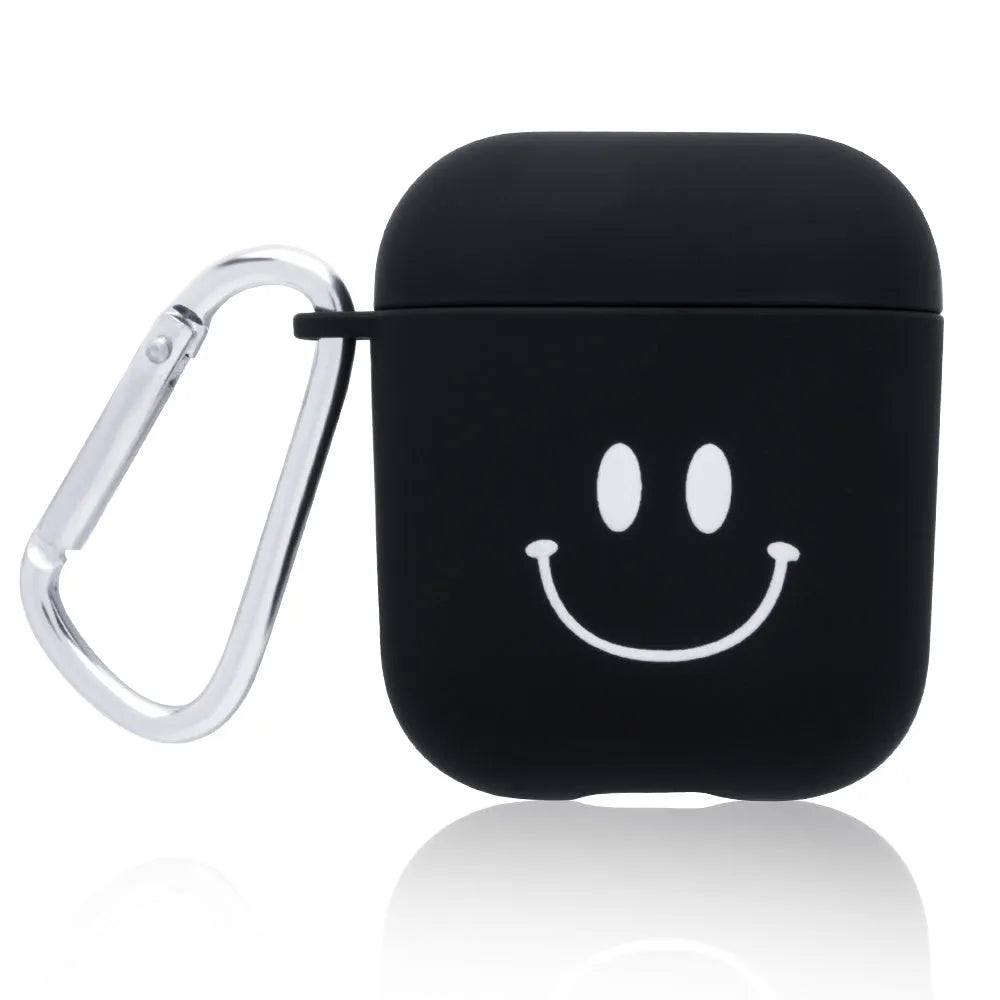 Black and pink AirPods earphone covers with decorative flower and smiley face back designs.
