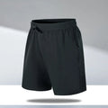 Man wearing loose black quick-dry sports shorts on a beach