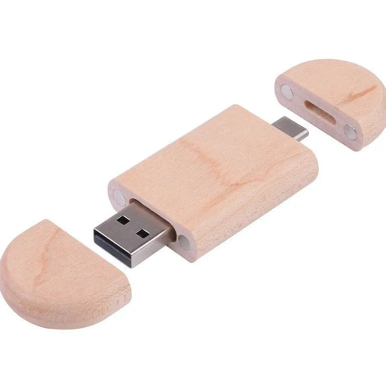 Maple wooden flash drive with USB and TYPE-C connectors on a wooden surface.