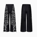 Women's loose printed polyester streetwear set showing hoodie, trousers, and seven-inch shorts.
