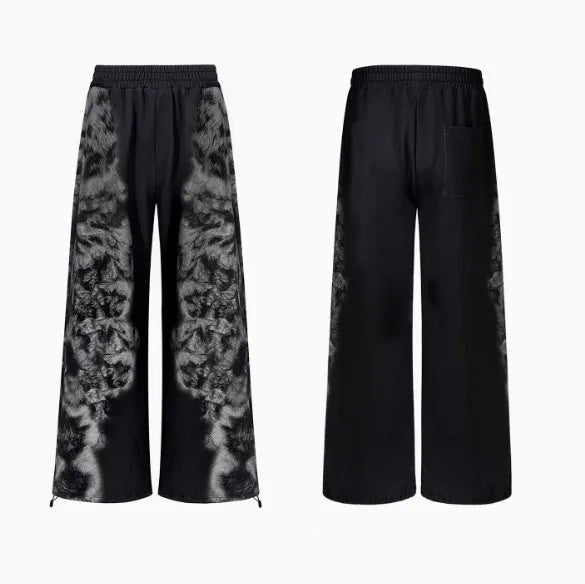 Women's loose printed polyester streetwear set showing hoodie, trousers, and seven-inch shorts.
