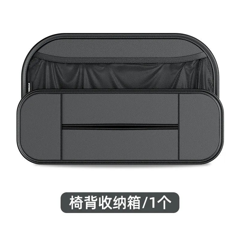 Black leather car seat rear storage bag measuring 36x24x8cm hanging on a vehicle seat back