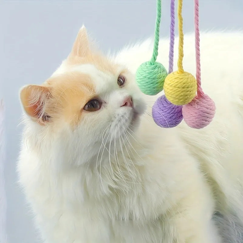 Colourful cat toy ball with rope attachment and built-in bell for interactive play
