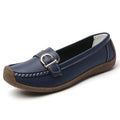 Women's beige casual loafers with a round toe and flat heel on a soft beef tendon sole.