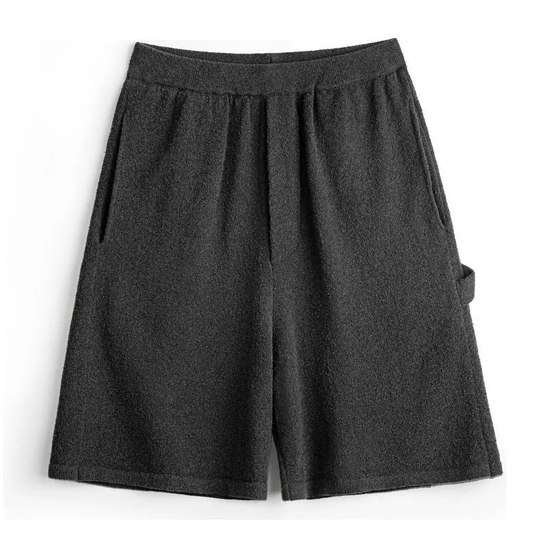 Cement grey straight leg sports shorts with an elastic waistband on a mannequin