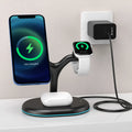 Black three-in-one magnetic wireless charger with simple design on a table.