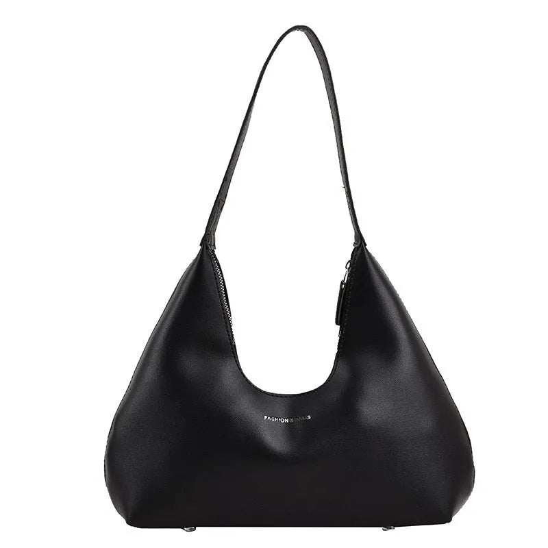 Brown retro PU shoulder handbag showing pillow shape, single strap, and organised interior with mobile phone pocket