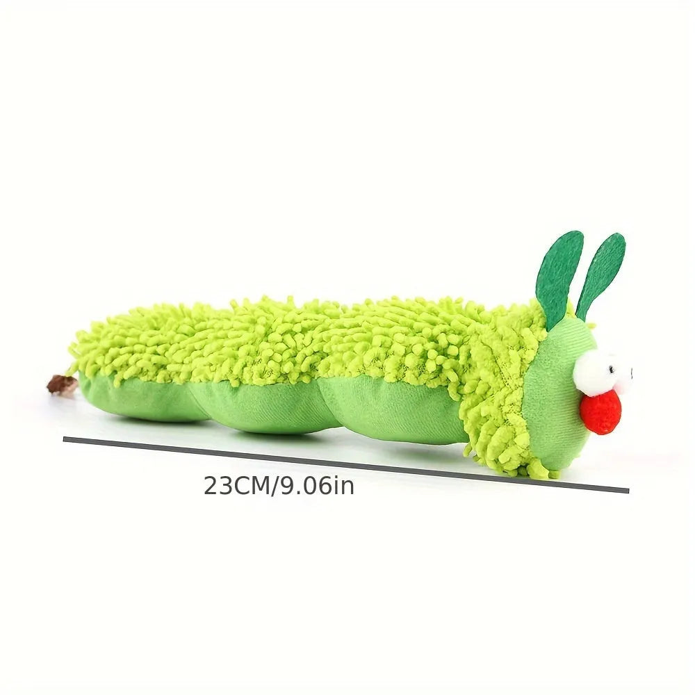 Green interactive plush cat toy pillow with rechargeable electronics, shown next to a measuring tape indicating 24cm length.
