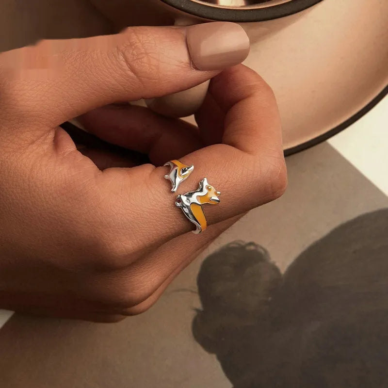 Silver ring with a raised cartoon corgi design in colour SCR1014-E.