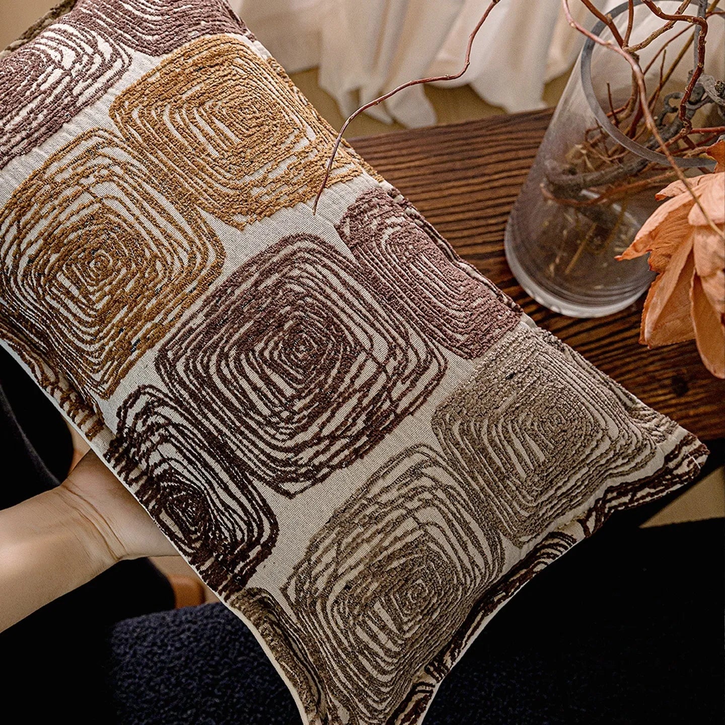 Square pillow cover with abstract coil pattern in cream and coffee colours