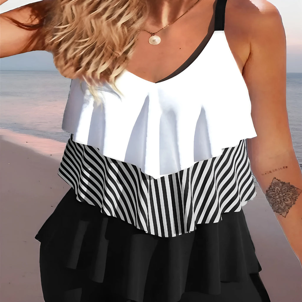 Women's two-piece bikini swimsuit with sleeveless backless design and spaghetti straps