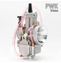 Seven sandblasted PWK motorcycle carburettors in sizes 21mm, 24mm, 26mm, 28mm, 30mm, 32mm, and 34mm.