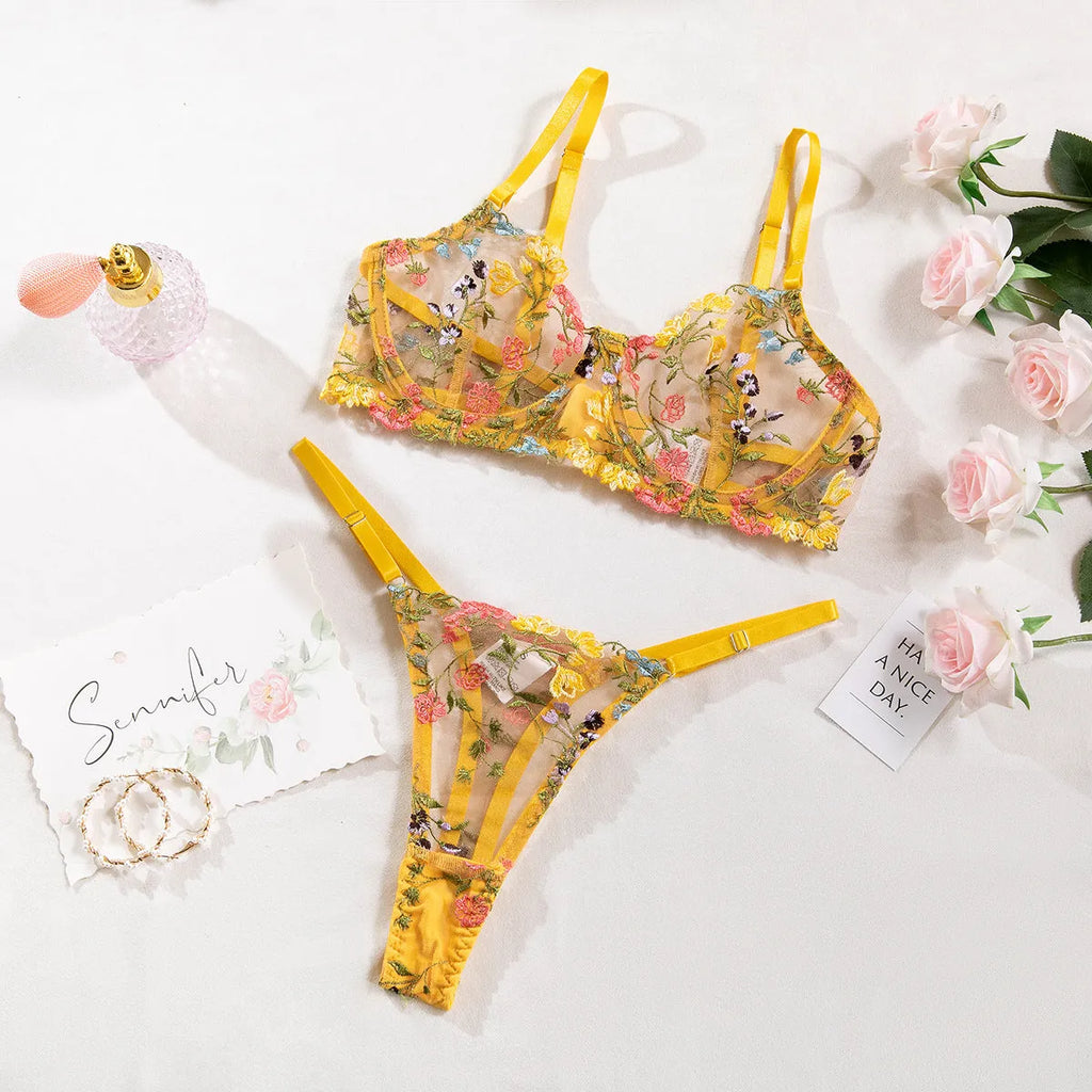 Floral mesh bra and matching T-back briefs set with a steel ring detail, shown in skin colour.