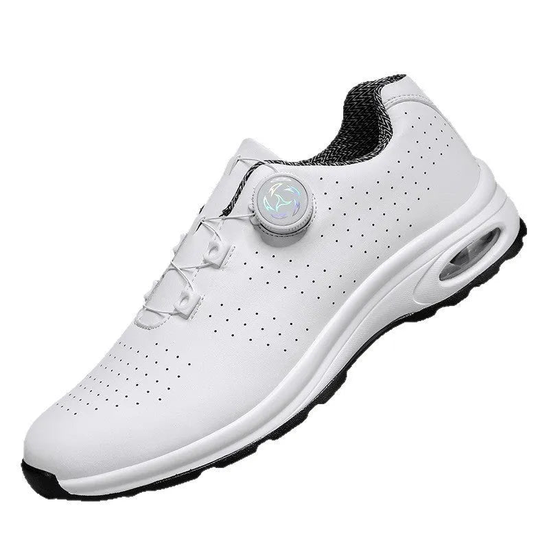 Low-top black and white casual tennis shoes with mesh upper and flat composite sole.