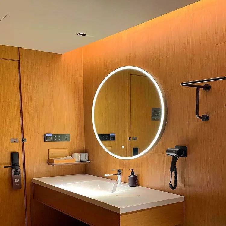 Round black aluminium alloy smart LED makeup mirror mounted on a wall with dimmable lighting.