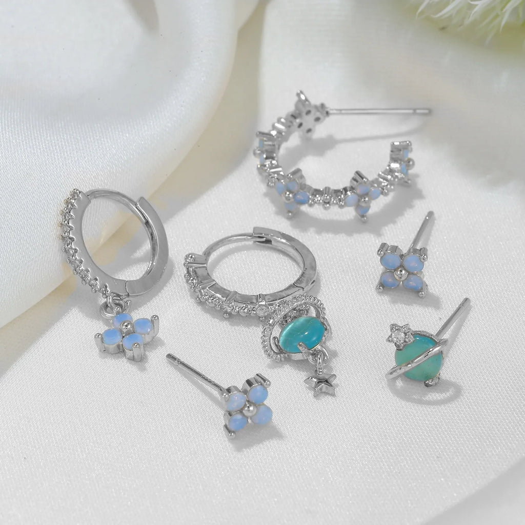 Gold and silver flower stud earrings with zircon stone mosaic centre.