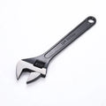 Stainless steel adjustable wrench with blackened finish showing adjustable jaw mechanism