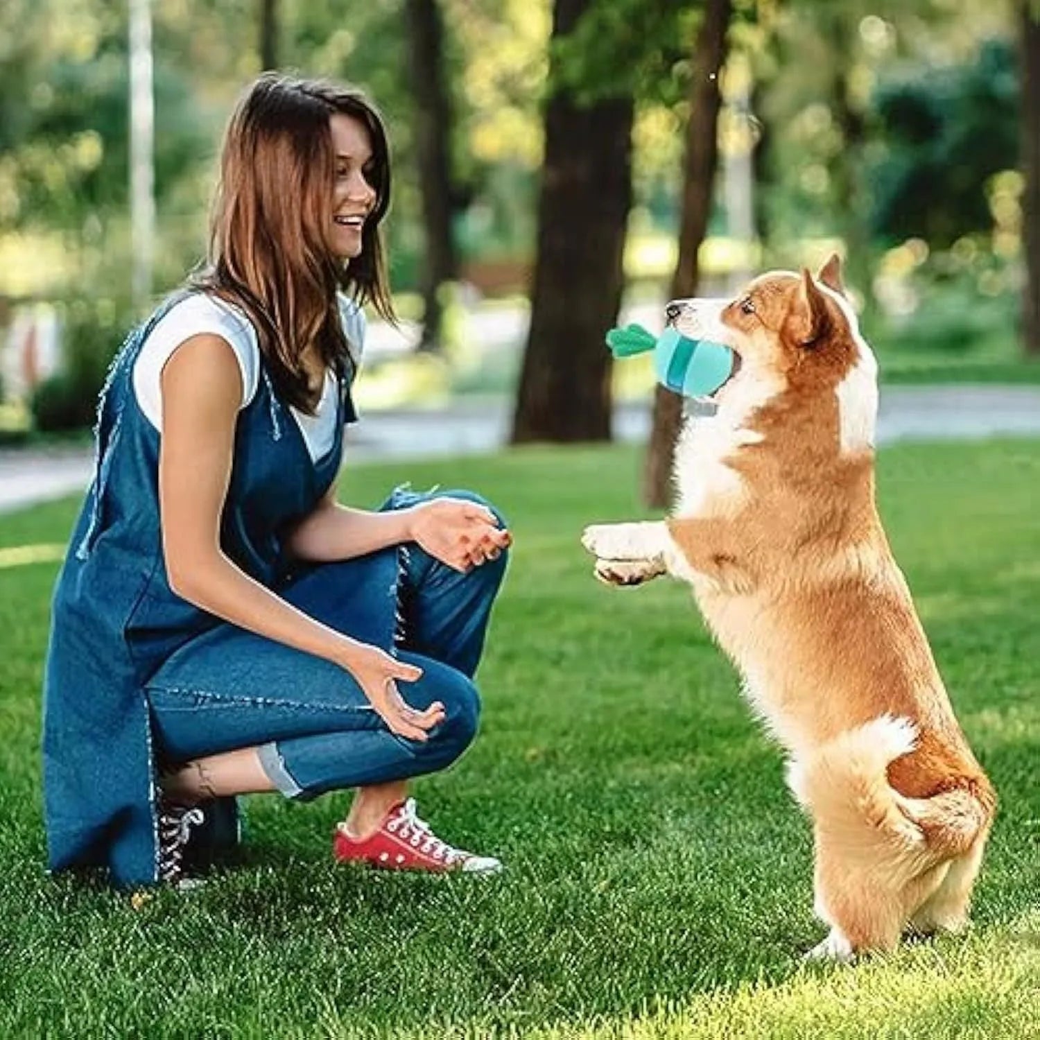 Blue durable rubber interactive dog treat dispenser ball with small leak holes