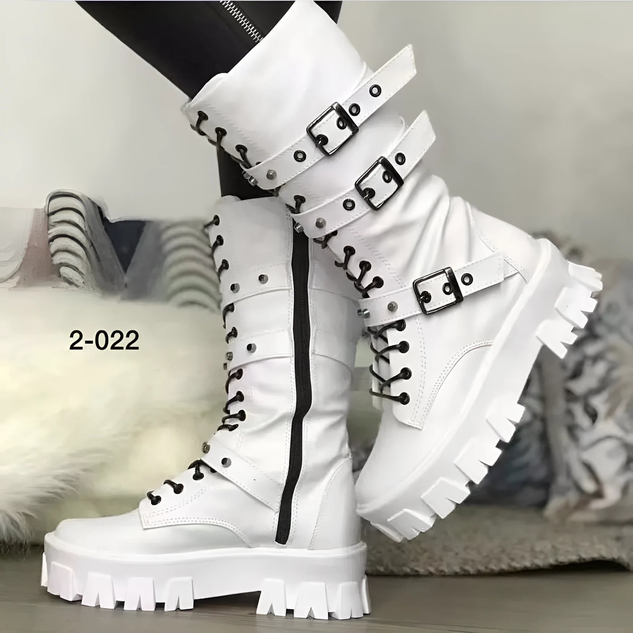 Black women's mid-calf knight boots with metal buckle and side zipper on a round toe.