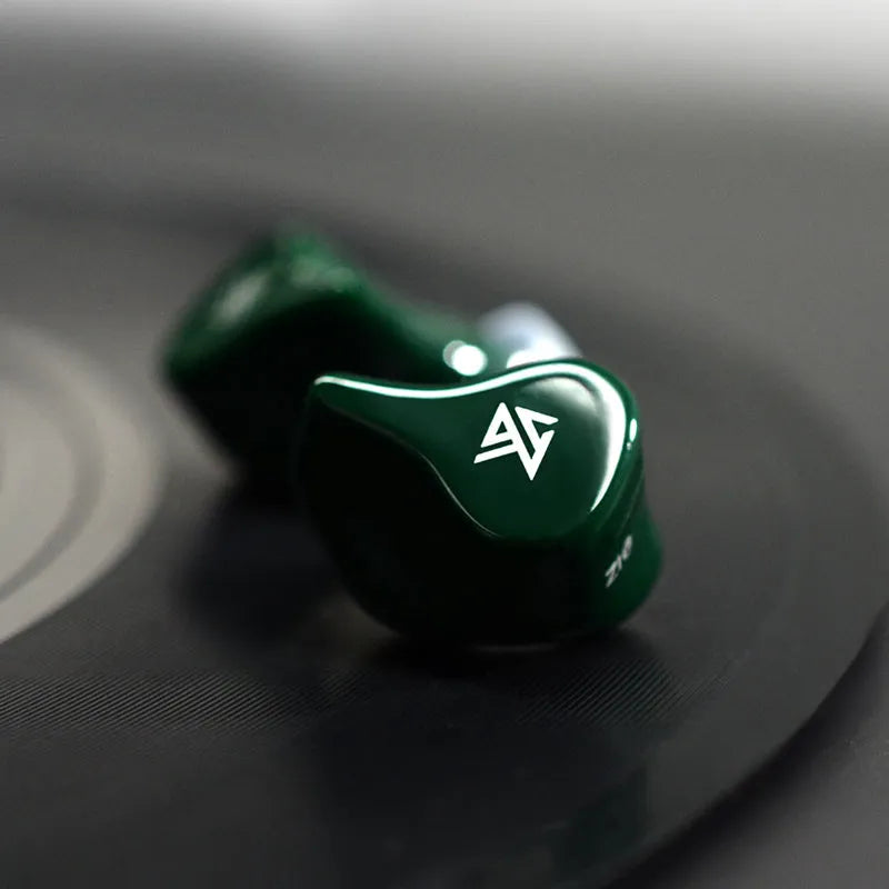 Black and green Z1 true wireless Bluetooth in-ear headphones with no connecting wire, shown on a white background.