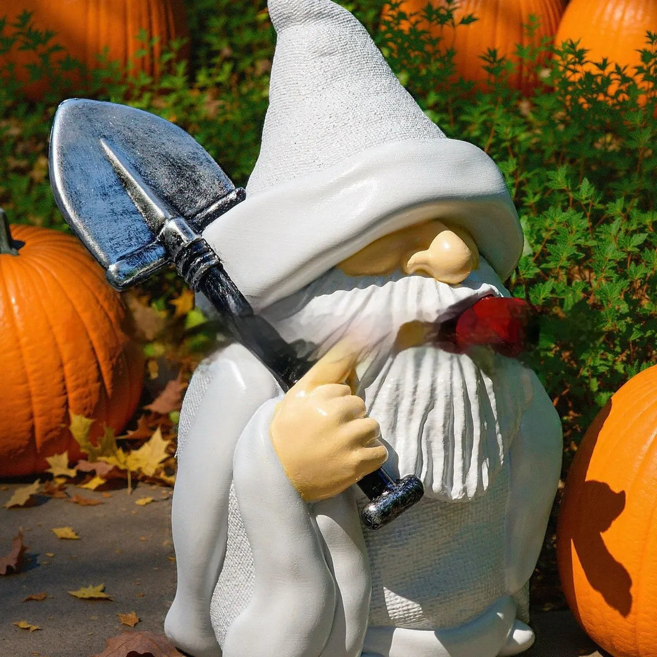 Close-up of a smoking shovel dwarf resin Christmas ornament with pipe, for garden or tree decoration.