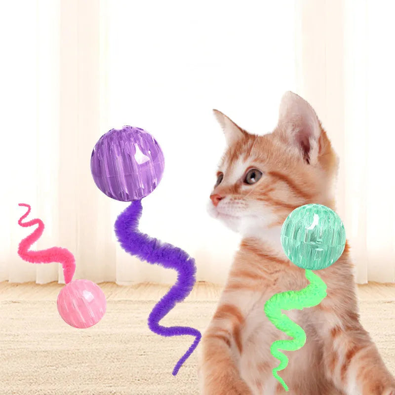 Interactive worm-shaped bouncy ball cat toy with tail in green, pink, or purple colours