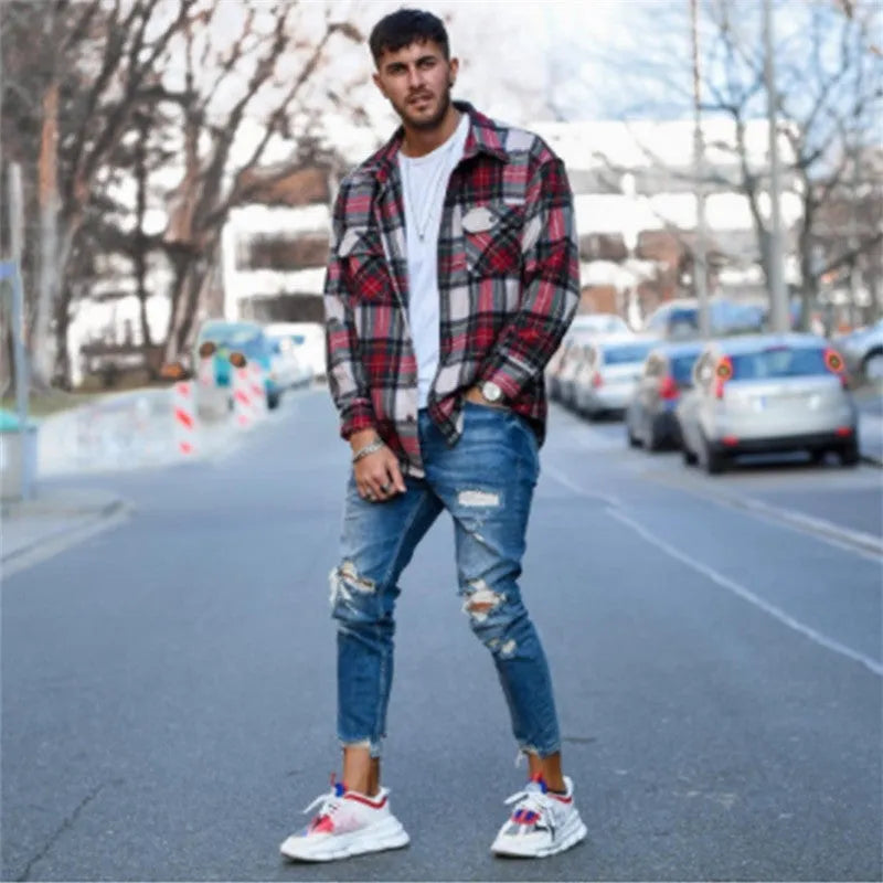 Men's deep blue cotton jeans with distressed hole detailing showing loose fit and six size options