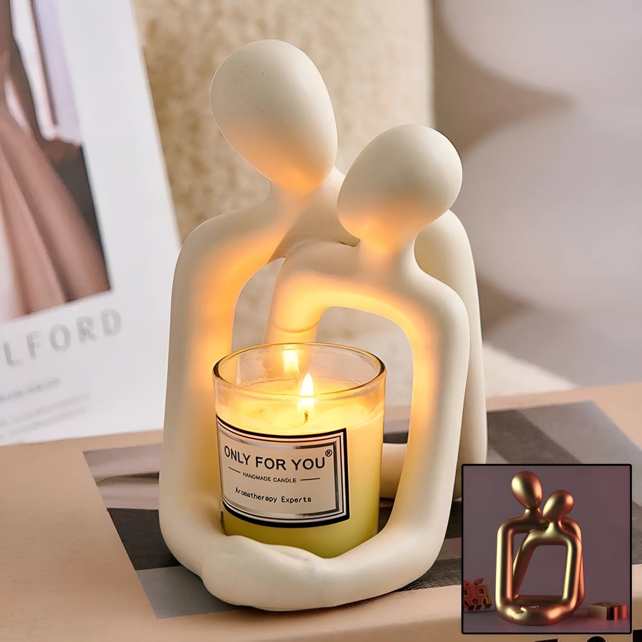 Modern couple resin statue in milky white or gold on a wooden surface.